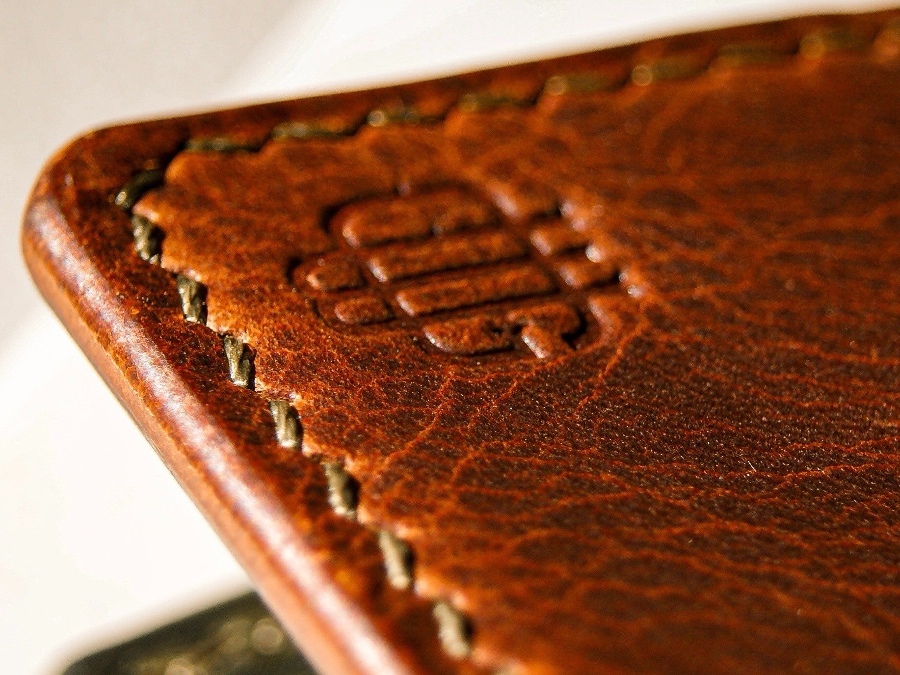 Close-up of full-grain leather edge and stitching